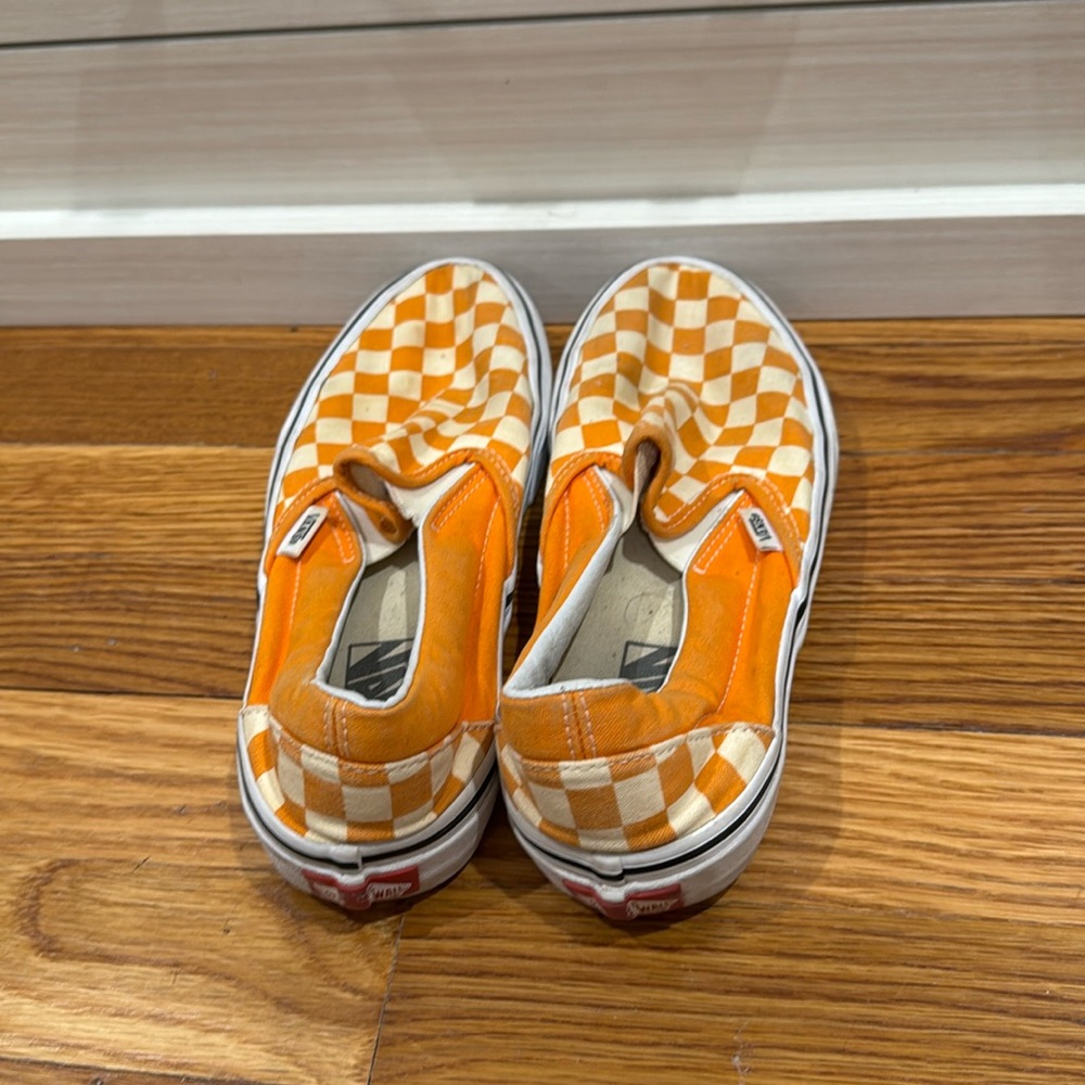 Orange checkered slip on Vans